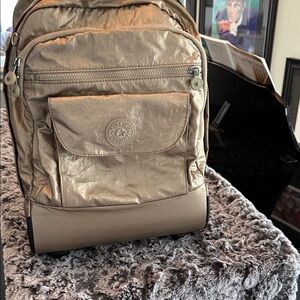 Kipling Metallic Gold rolling suit case back pack $228 retail like used once
